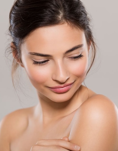 Female smile on her flawless skin | skin care | Novique Medical Aesthetics | Doylestown, PA