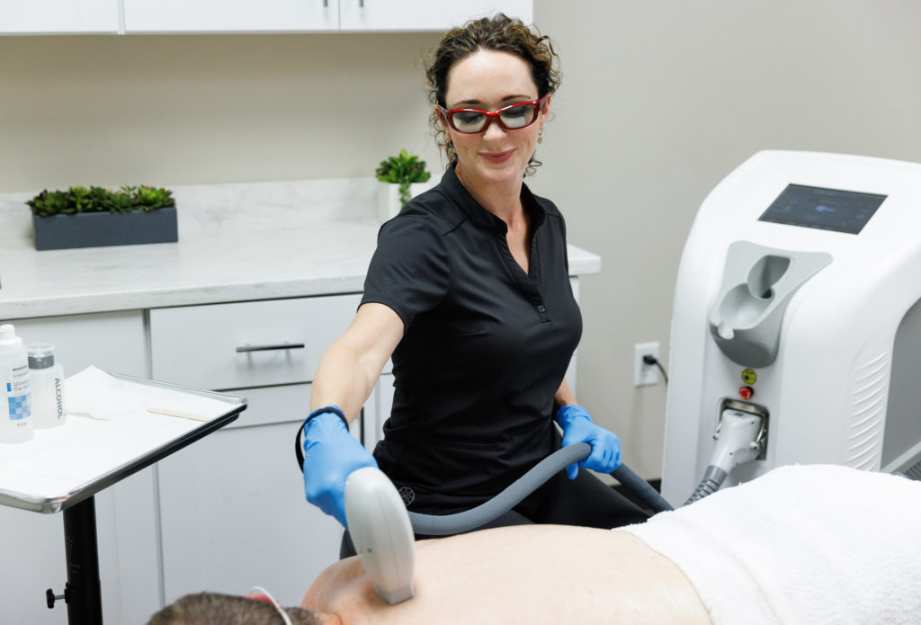Sciton-12-1-1024×695 practitioner doing laser hair removal